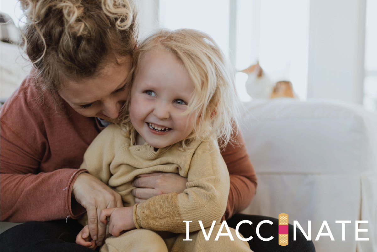 Mom with young son and "I Vaccinate" logo