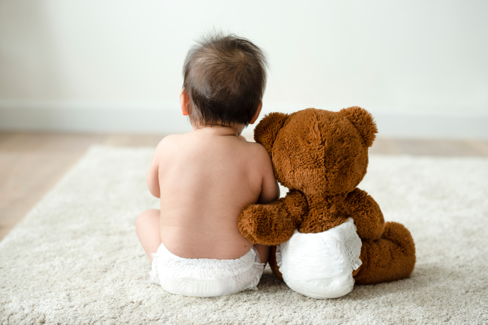 child-sitting-with-teddy-bear