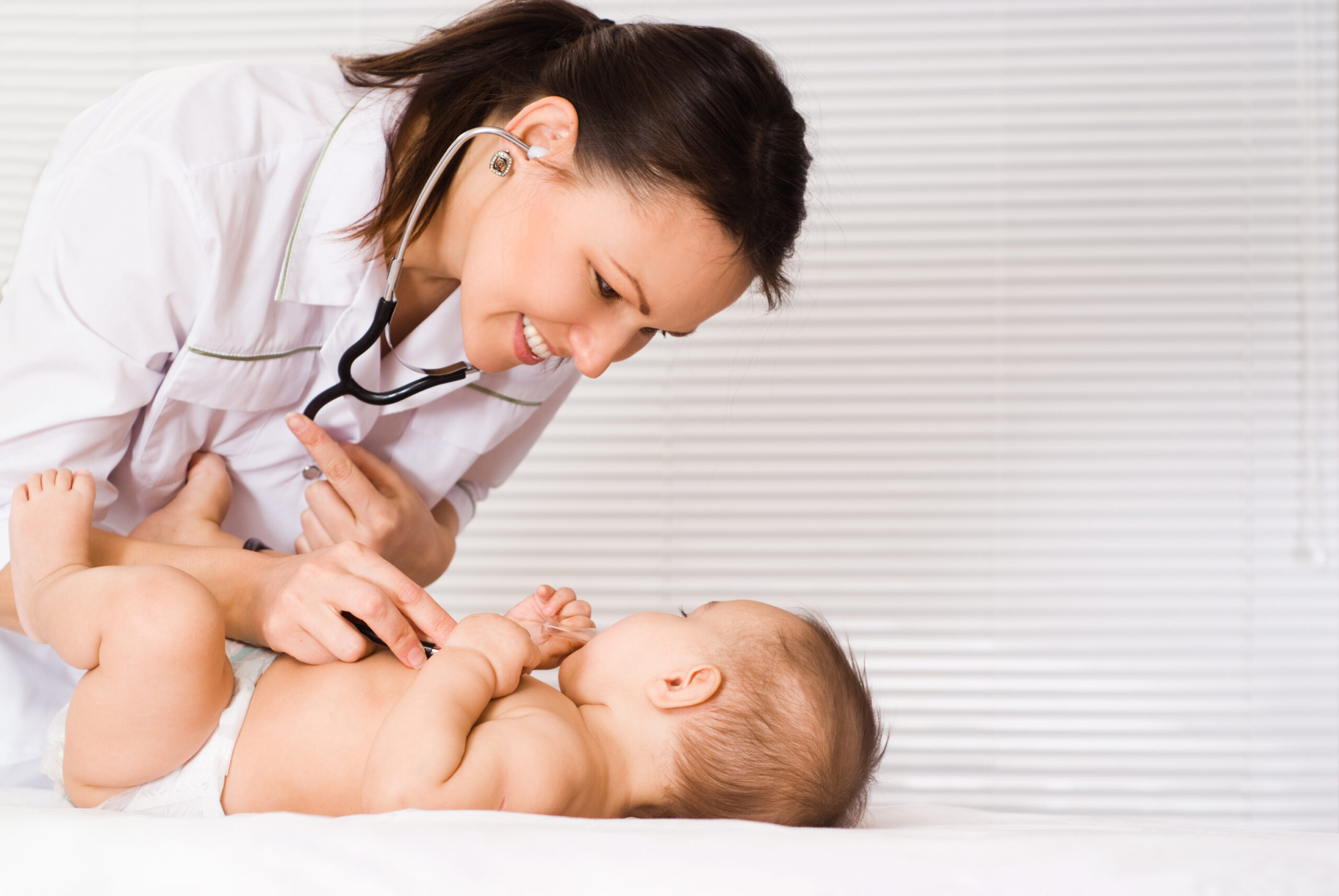 Doctor checking the heartbeat of a baby