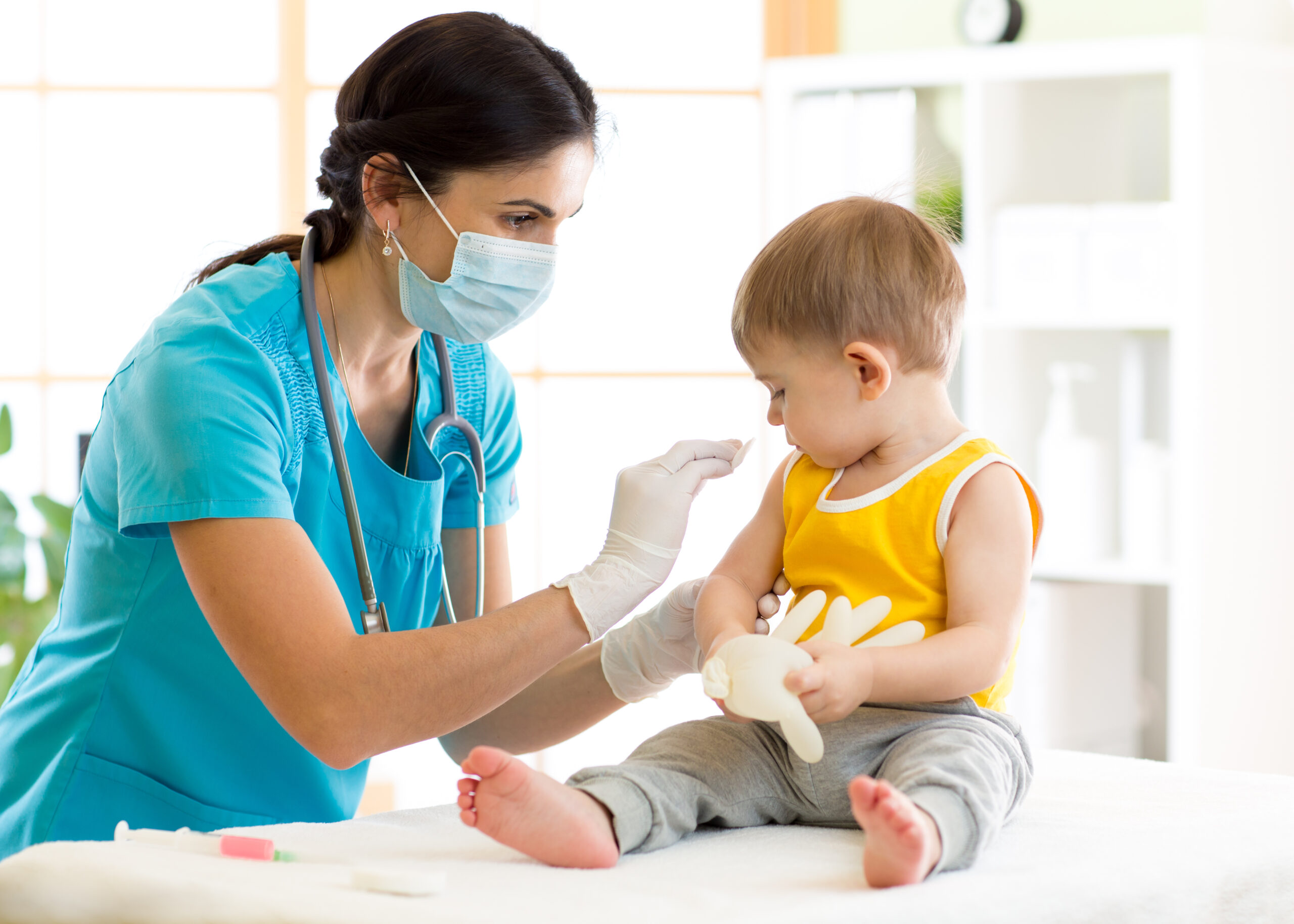 Toddler preparing to receive a vaccination